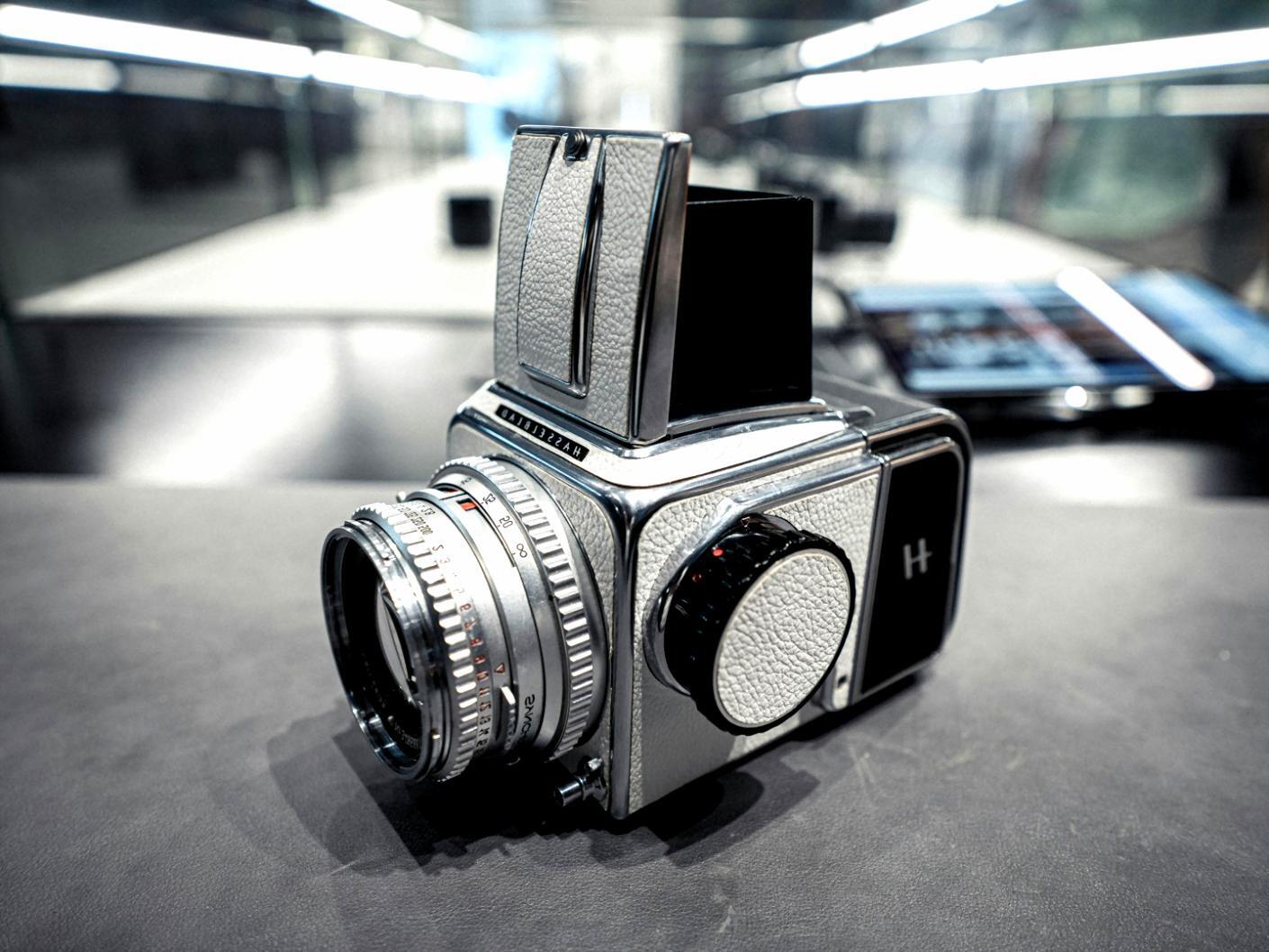 Film production crew setting up lighting equipment on set