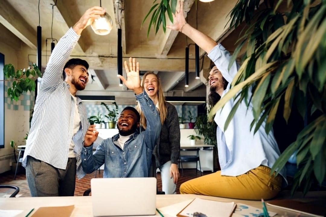 Team member reviewing footage on multiple monitors in editing suite